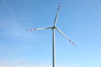 Modern wind turbine against blue sky. Alternative energy source