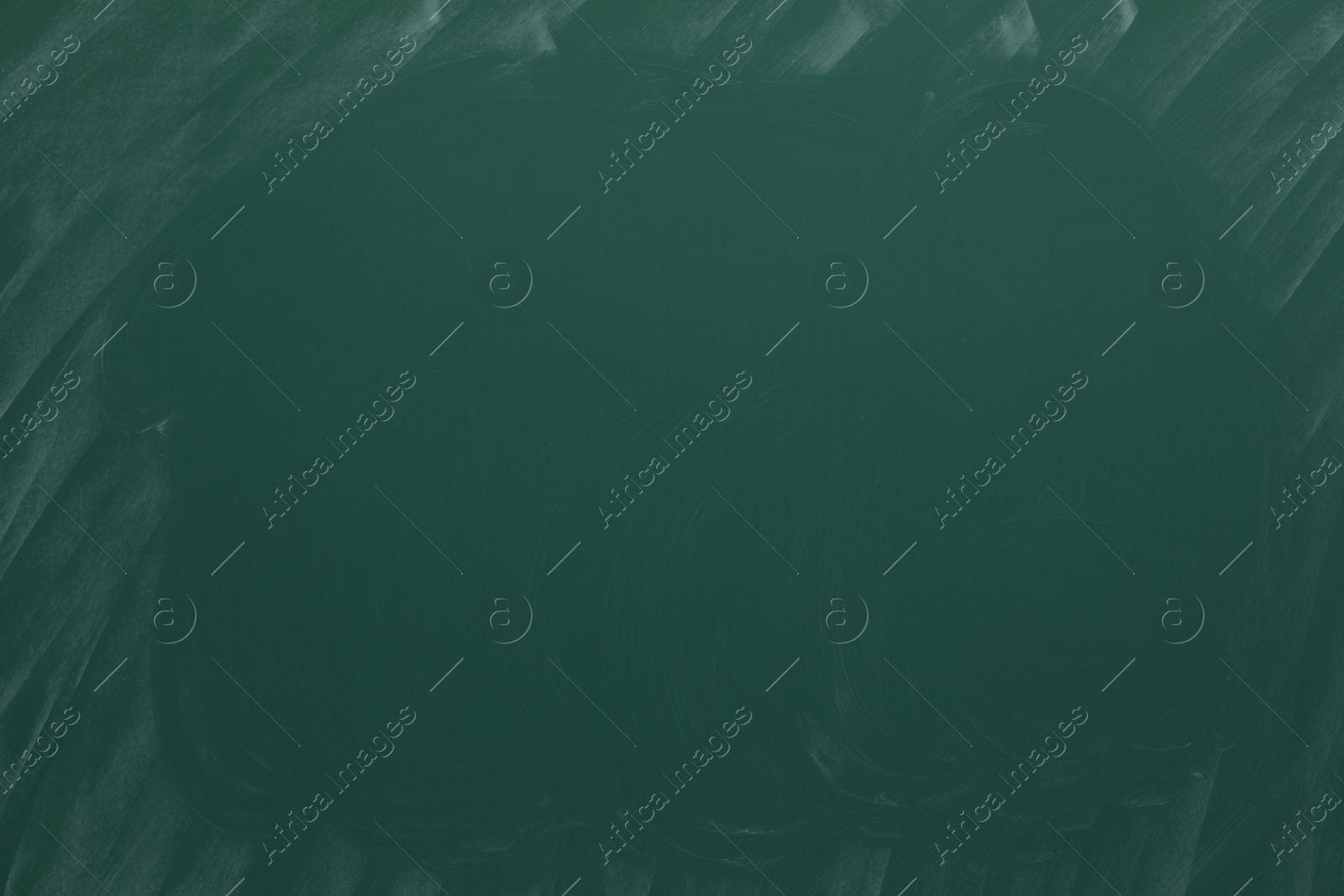 Photo of Dirty green chalkboard as background. School equipment