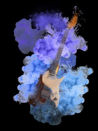 Electric guitar in colorful smoke on black background, stylish design. Rock music concept