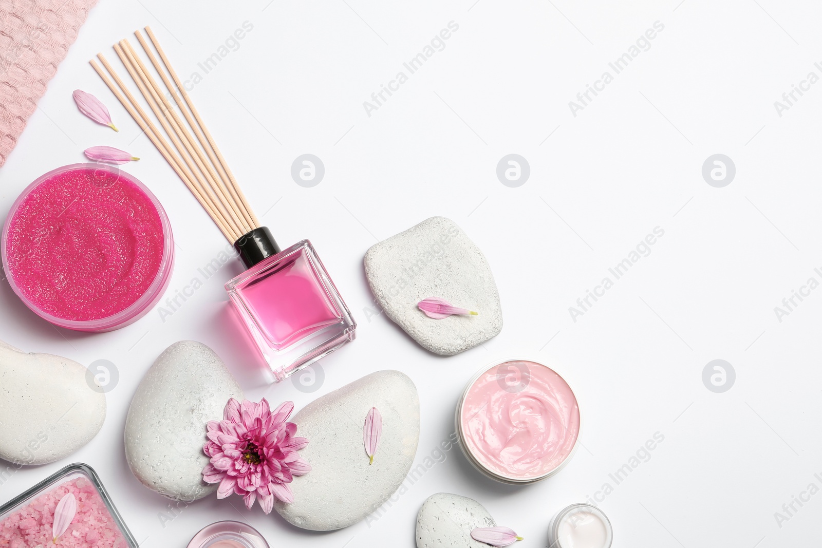 Photo of Flat lay composition with spa stones and space for text on white background