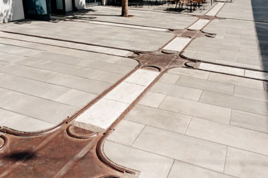 Photo of Street tiles with metal ground surface indicators, closeup