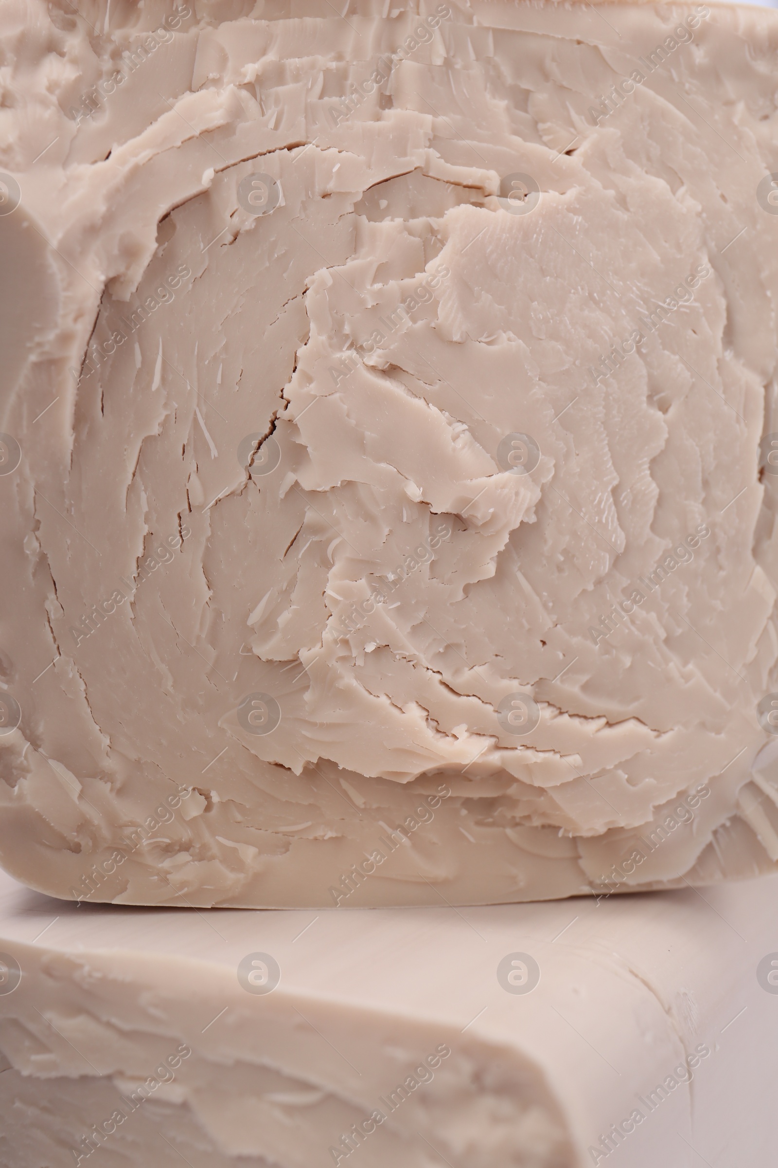 Photo of Texture of compressed yeast as background, closeup