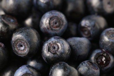 Photo of Many tasty fresh bilberries as background, closeup view