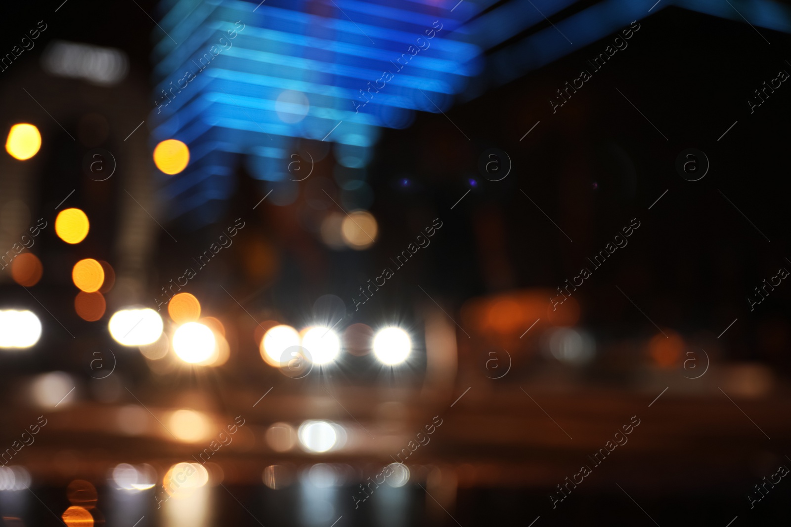 Photo of Blurred view of cityscape with bokeh effect. Night life