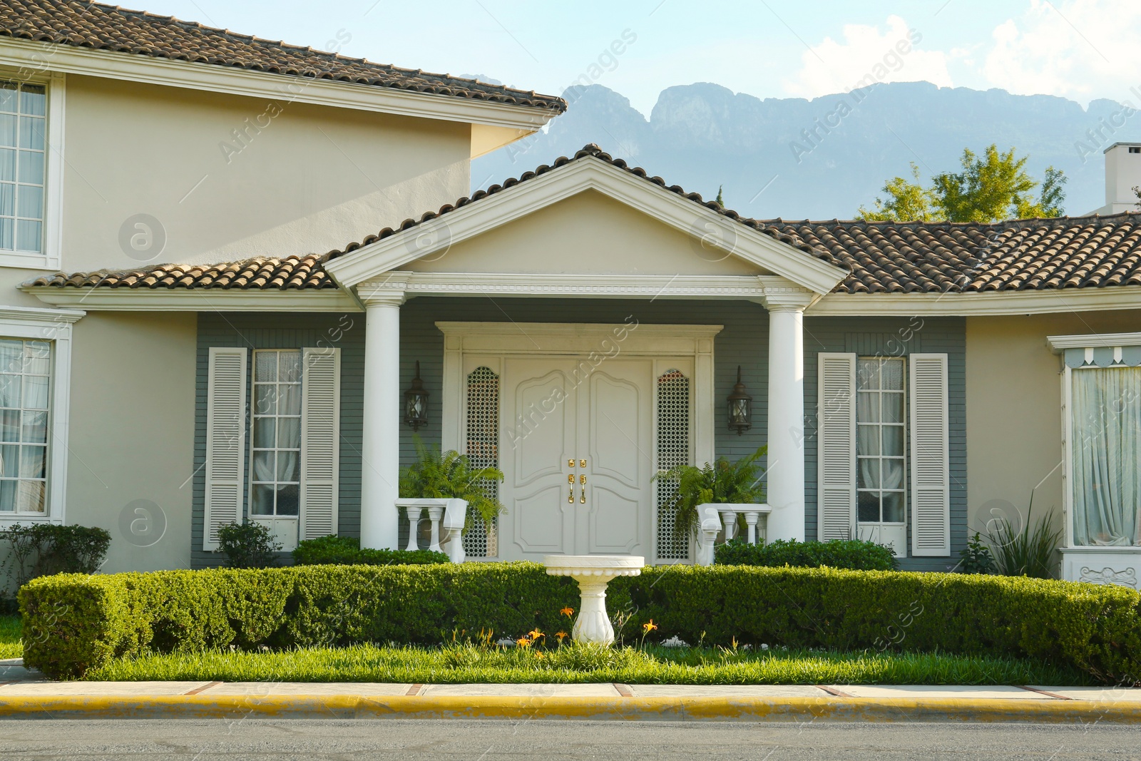 Photo of Exterior of beautiful modern house in city street