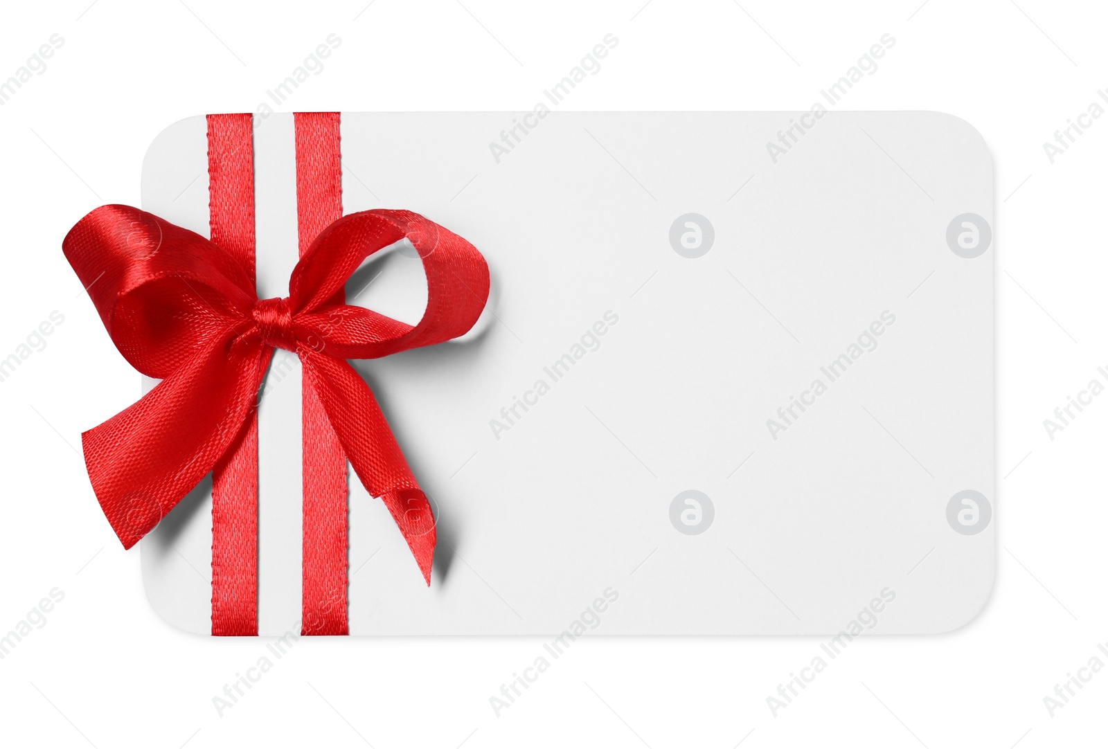 Photo of Blank gift card with red bow isolated on white, top view