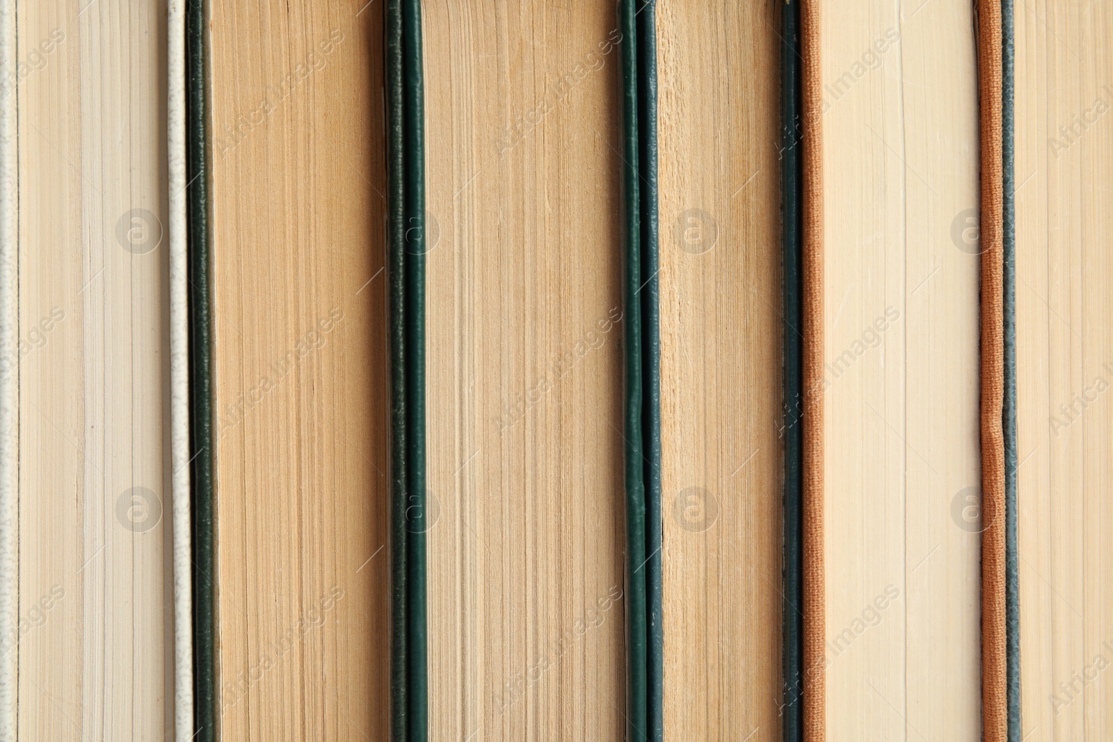 Photo of Many old books as background, top view