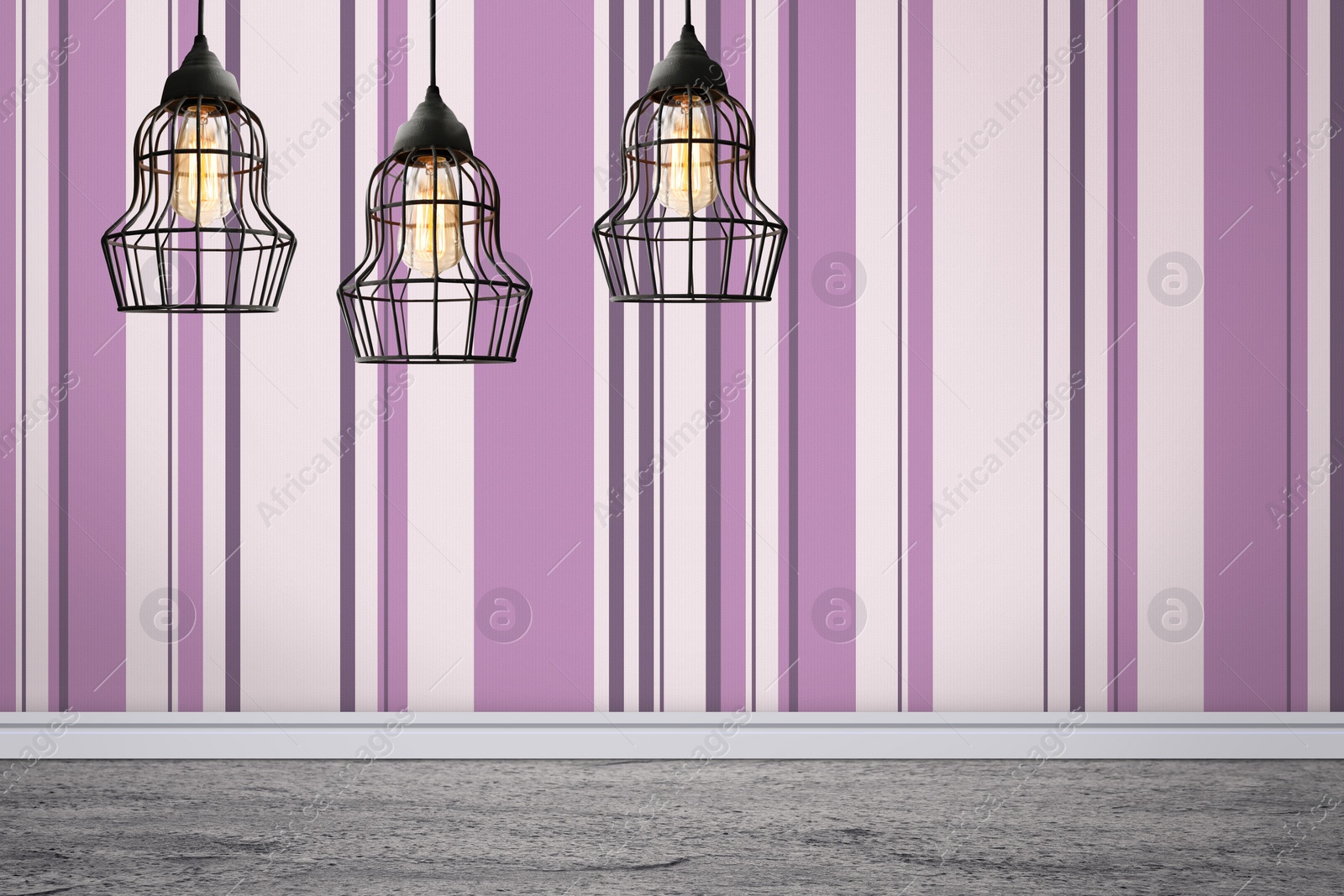 Image of Stylish pendant lamps hanging near striped wall in room