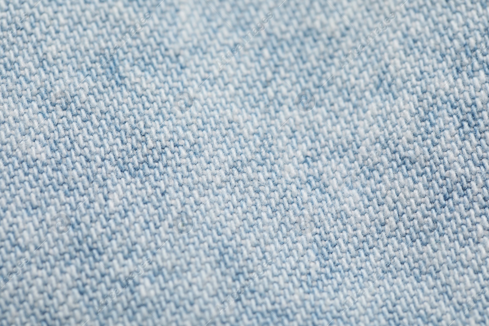 Photo of Texture of soft light blue fabric as background, closeup