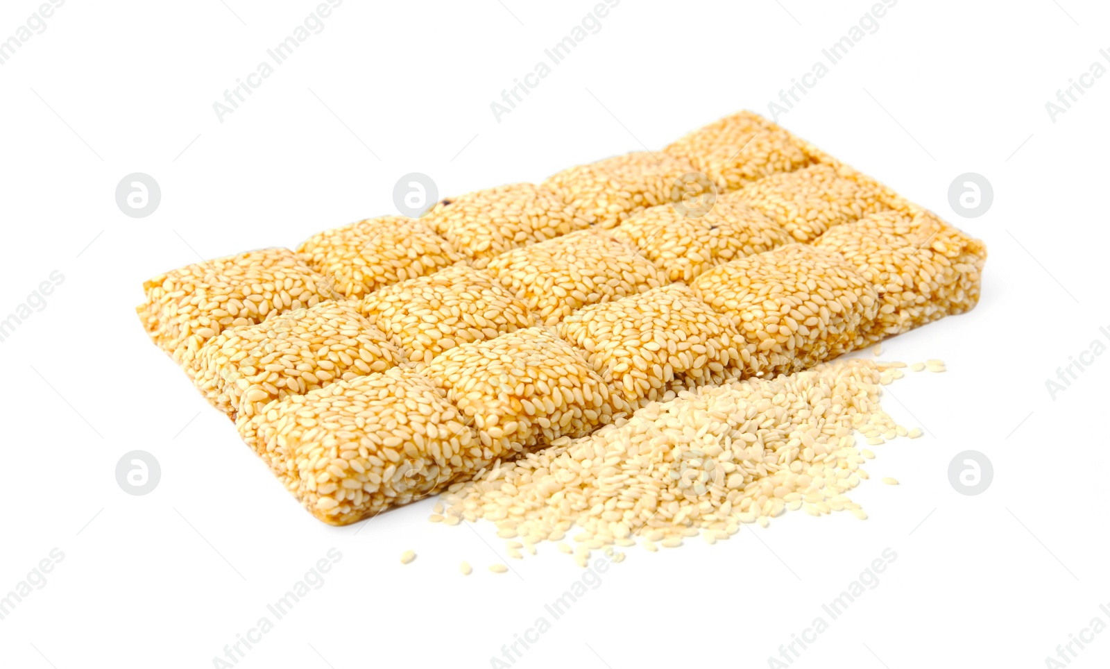 Photo of Delicious sweet kozinaki bar and sesame seeds on white background