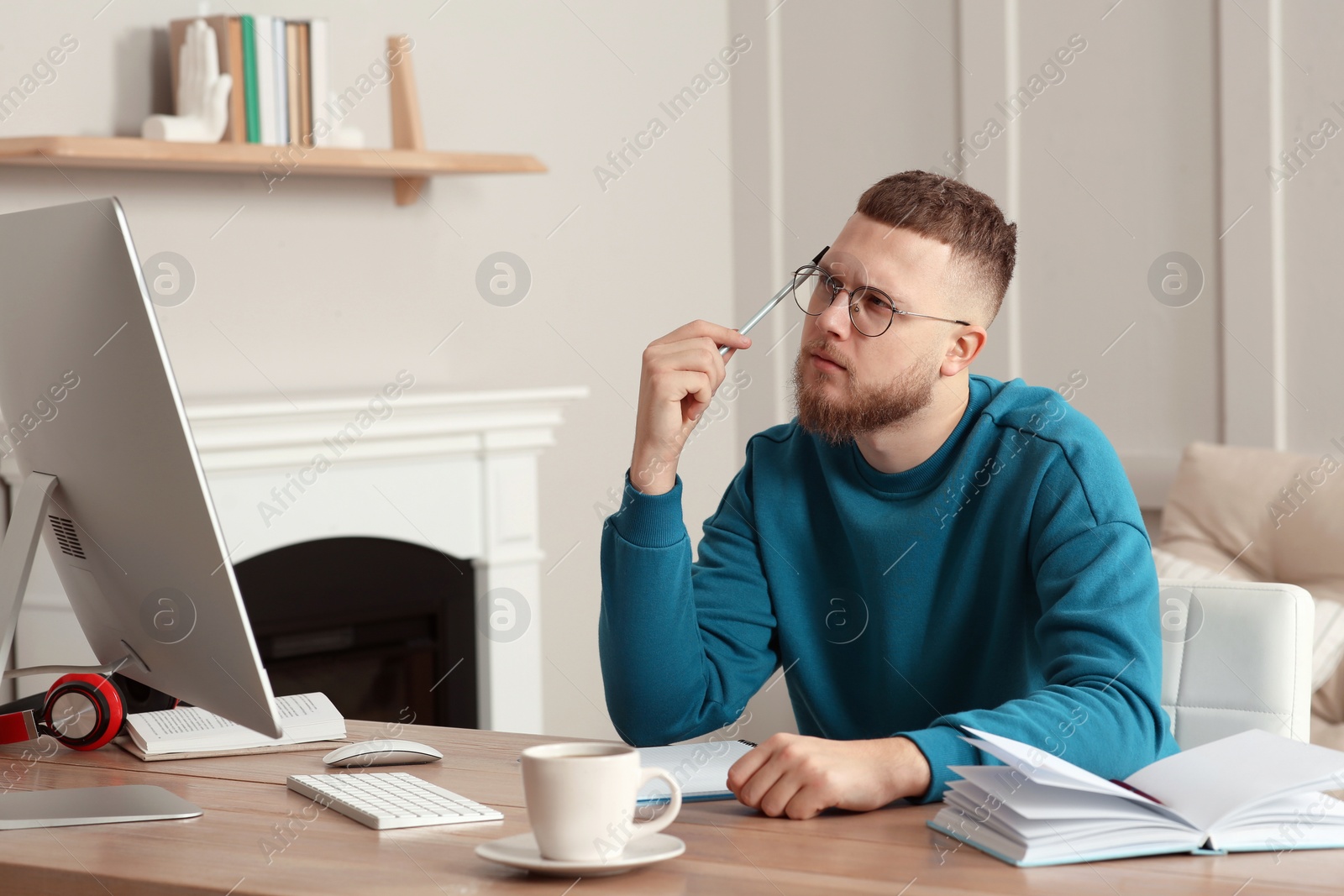 Photo of Online test. Man studying with computer at home