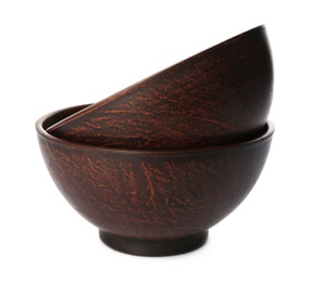 Stylish brown clay bowls on white background