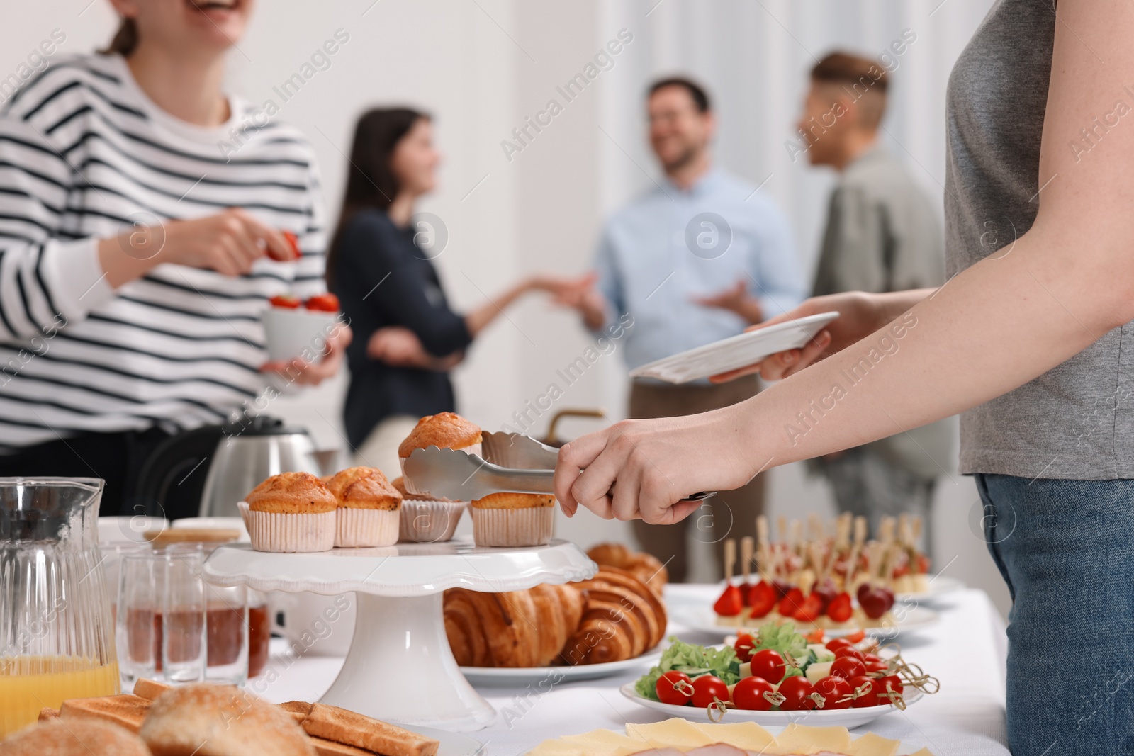 Photo of Coworkers having business lunch in restaurant, closeup