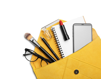 Stylish woman's bag with smartphone and accessories on white background, top view