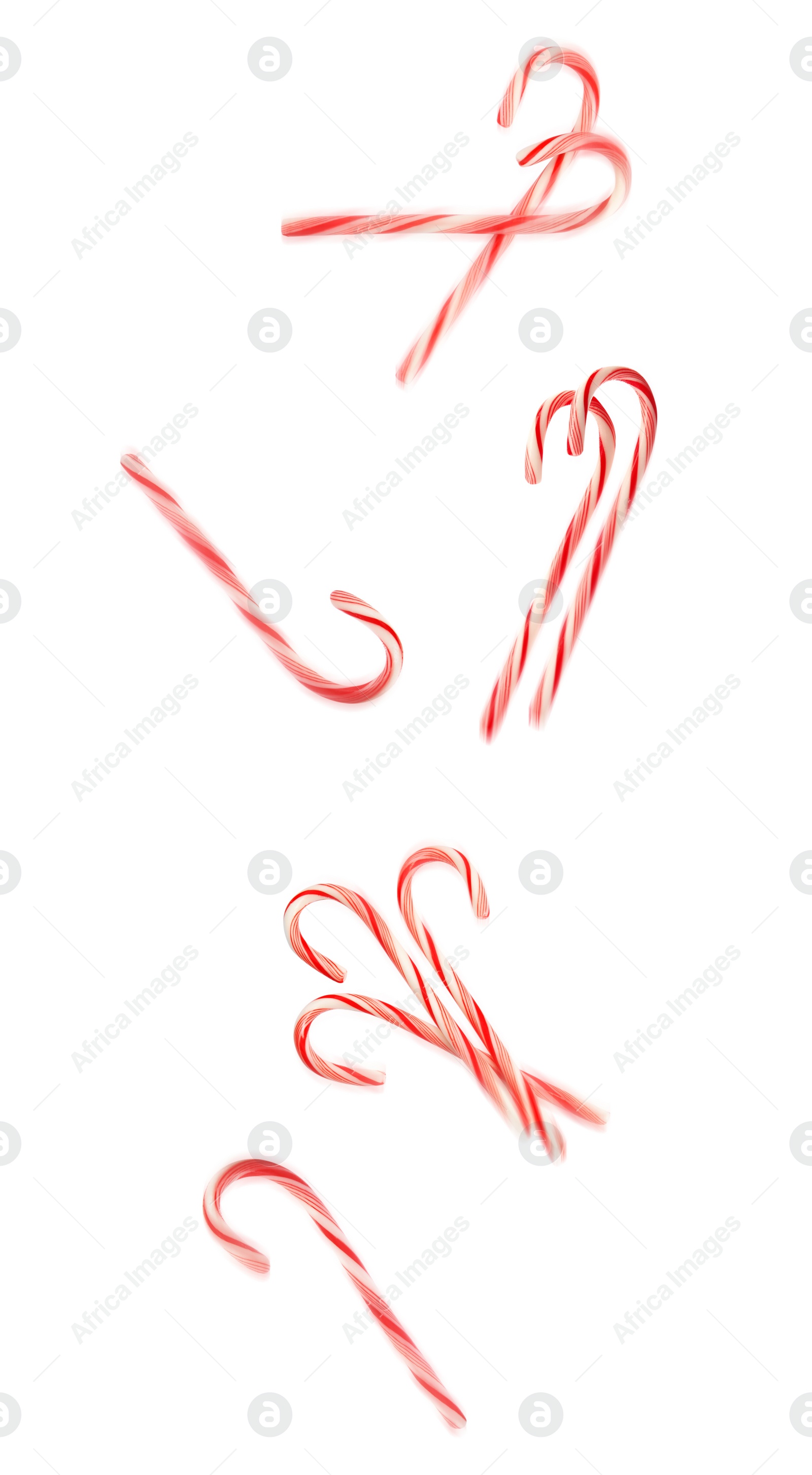 Image of Tasty Christmas candy canes falling on white background