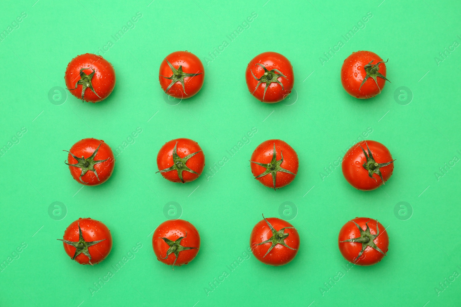 Photo of Flat lay composition with ripe tomatoes on color background