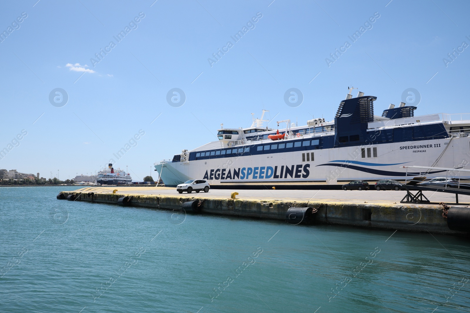 Photo of PIRAEUS, GREECE - MAY 19, 2022: Picturesque view of port with Speedrunner III vessel on sunny day