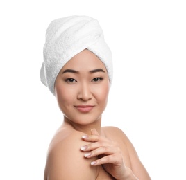 Portrait of beautiful Asian woman with towel on head against white background. Spa treatment