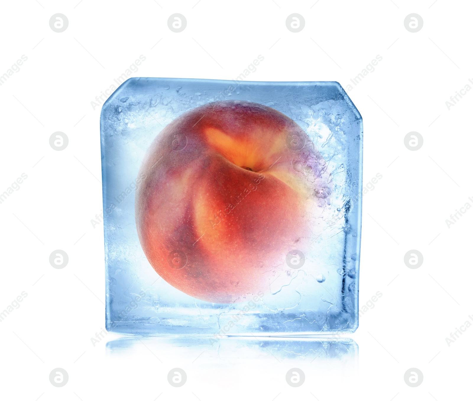 Image of Frozen food. Raw peach in ice cube isolated on white