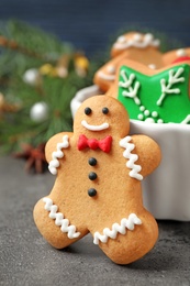 Photo of Tasty homemade Christmas cookies on grey table, closeup view
