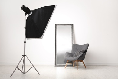 Photo of Interior of modern photo studio with professional equipment