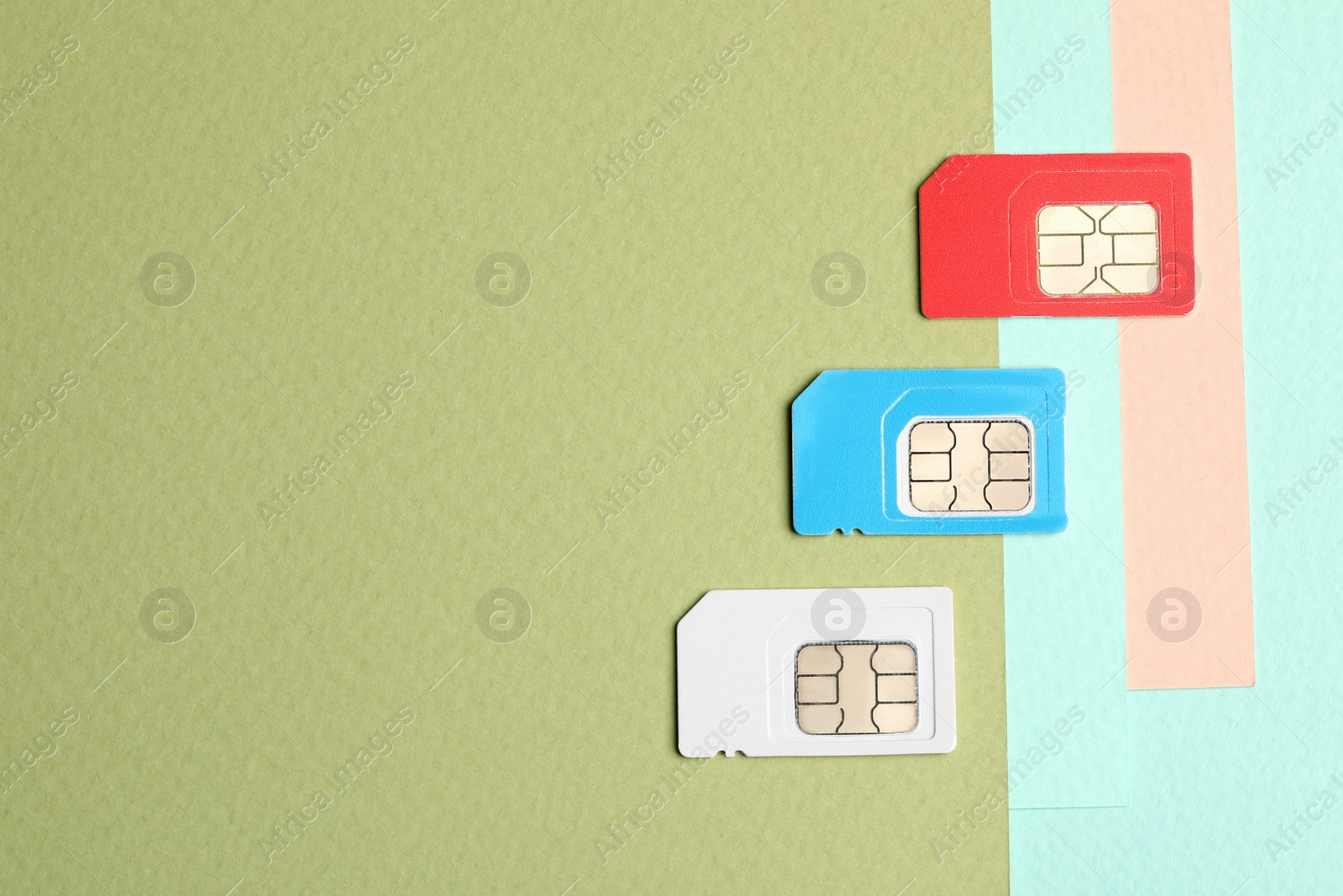 Photo of Different SIM cards on color background, flat lay. Space for text