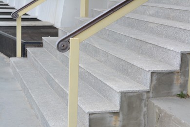 Photo of View of empty concrete stairs with railings outdoors