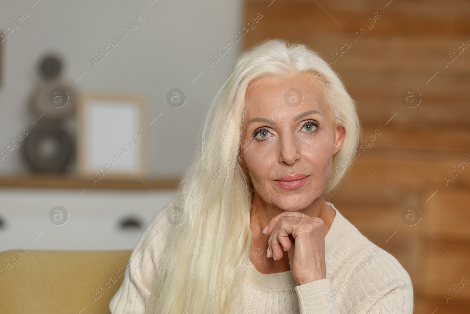 Photo of Portrait of elegant mature woman at home