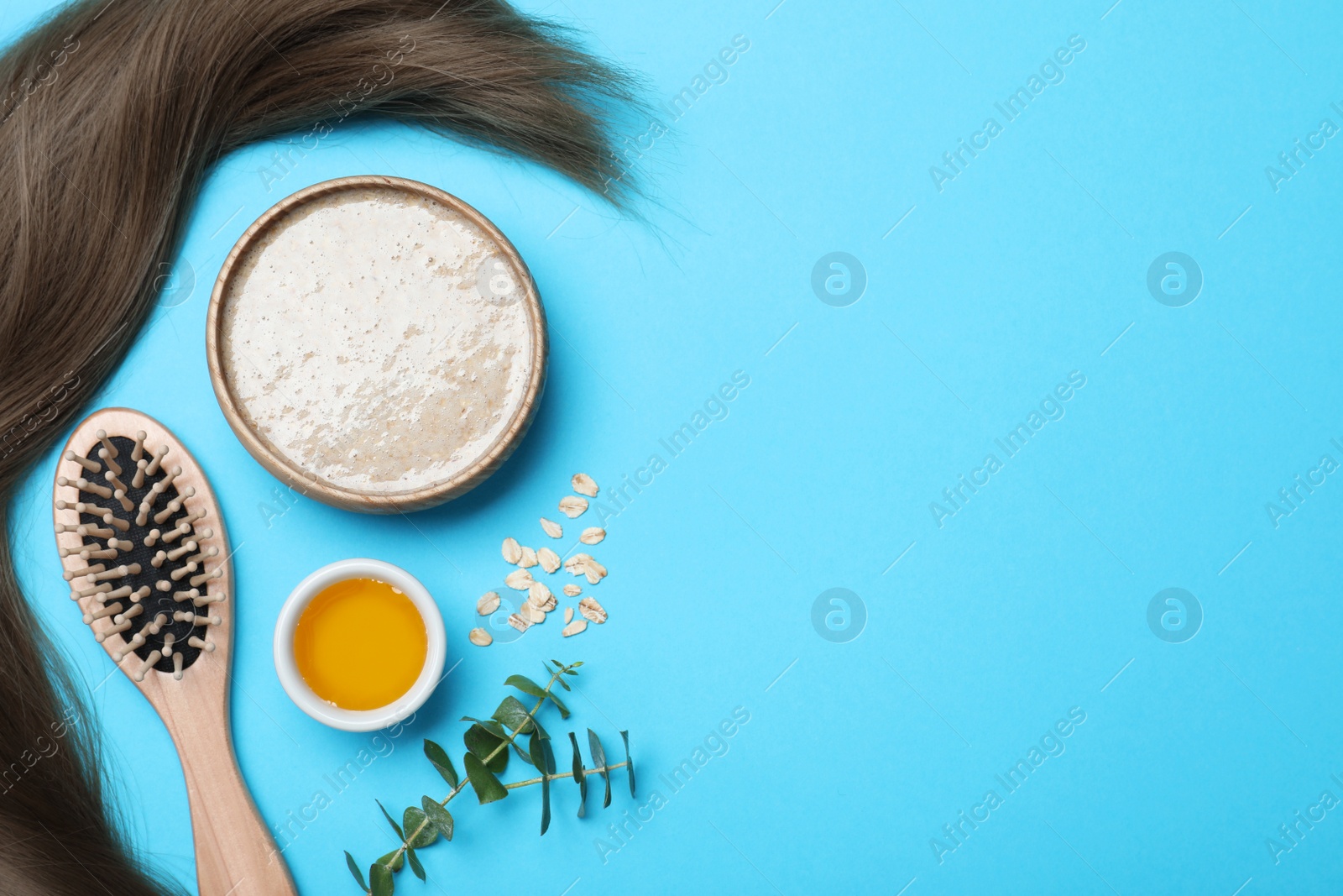 Photo of Flat lay composition with homemade hair mask and ingredients on light blue background. Space for text