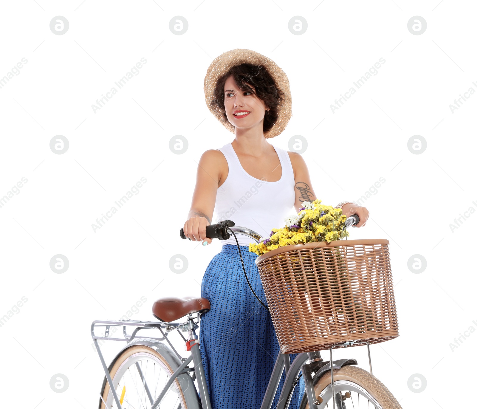 Photo of Portrait of beautiful young woman with bicycle on white background