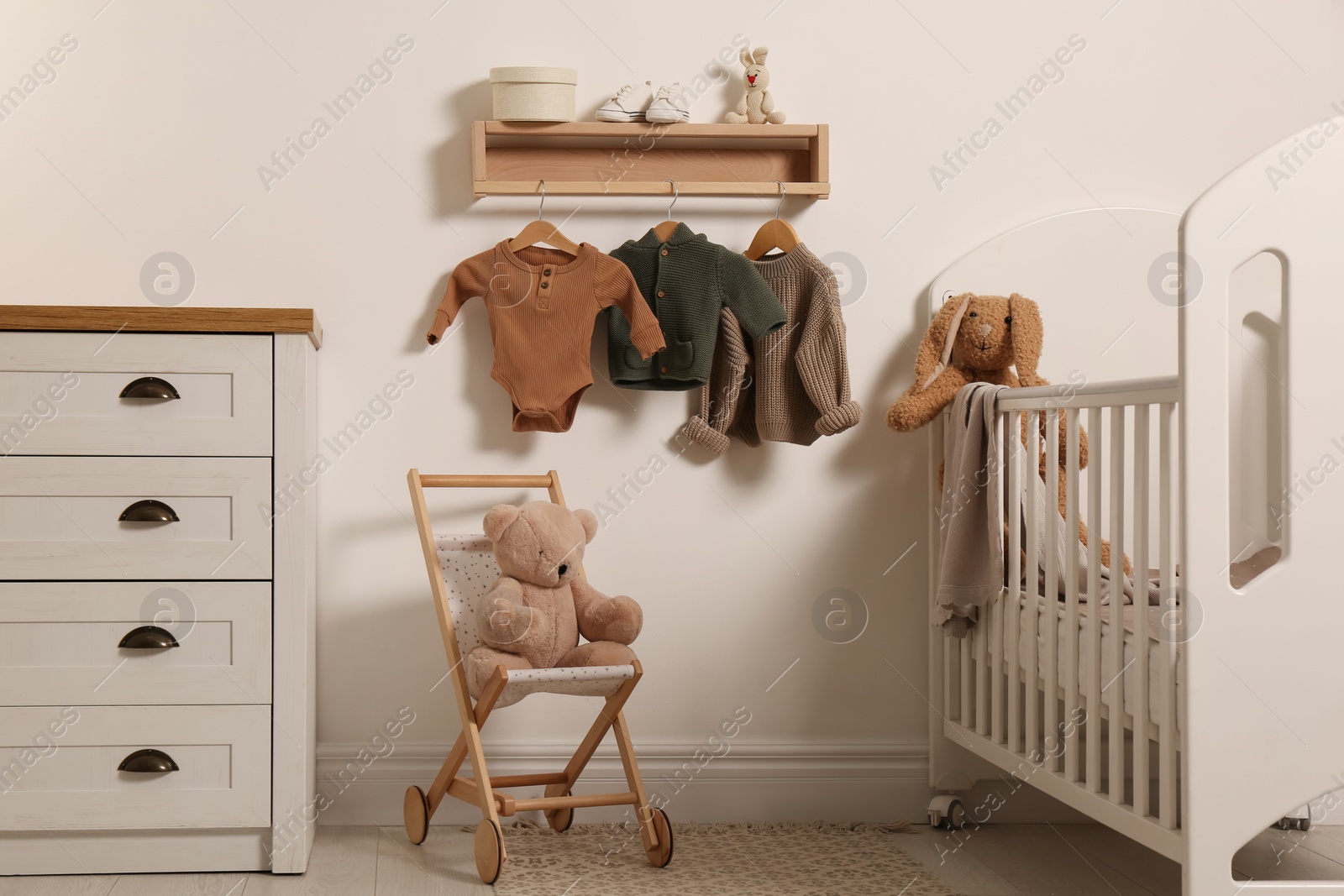 Photo of Nursery interior with stylish furniture, clothes and accessories