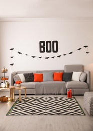 Photo of Modern room decorated for Halloween. Festive interior