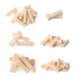 Set with delicious rusks on white background