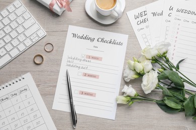 Photo of Flat lay composition with Wedding Checklist on wooden table