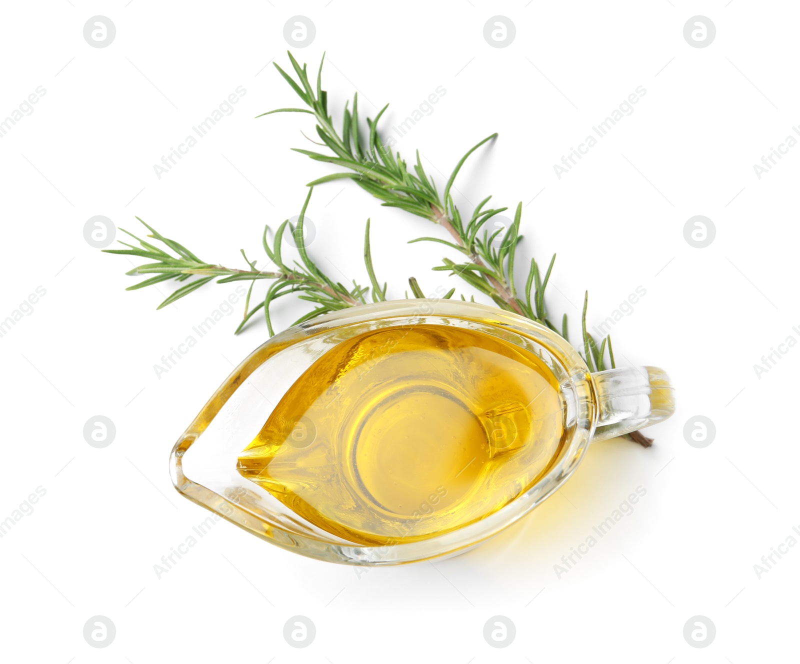 Photo of Gravy boat of rosemary oil on white background, top view