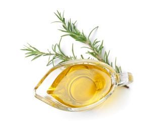 Gravy boat of rosemary oil on white background, top view