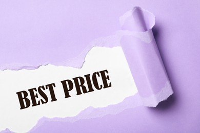 Image of Phrase Best Price on white background, view through torn violet paper