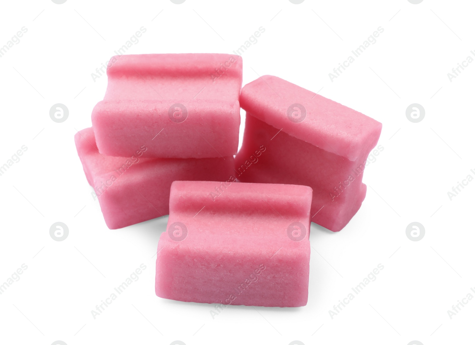 Photo of Many tasty pink chewing gums on white background