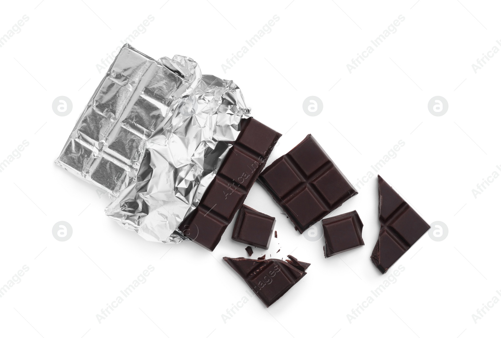 Photo of Pieces of delicious dark chocolate bar on white background, top view