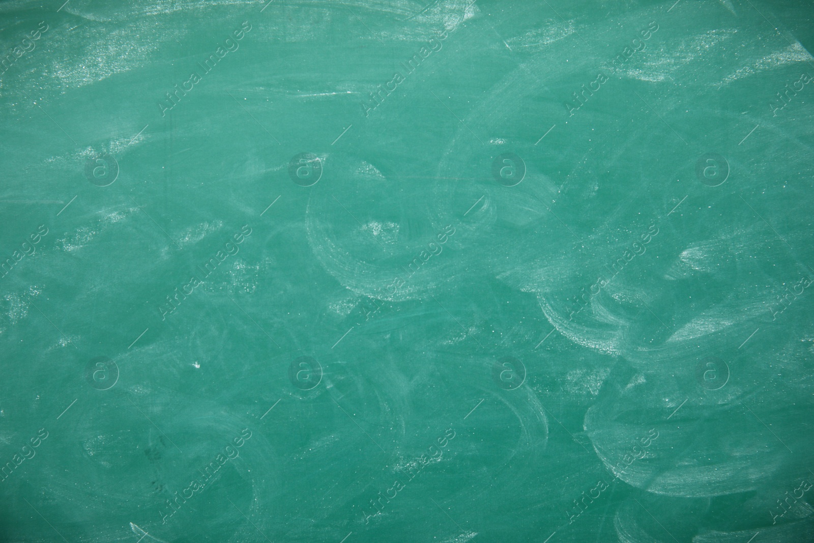 Photo of Dirty green chalkboard as background. Space for text