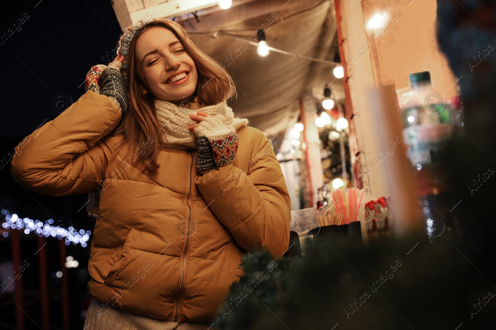 Photo of Happy woman spending time at Christmas fair