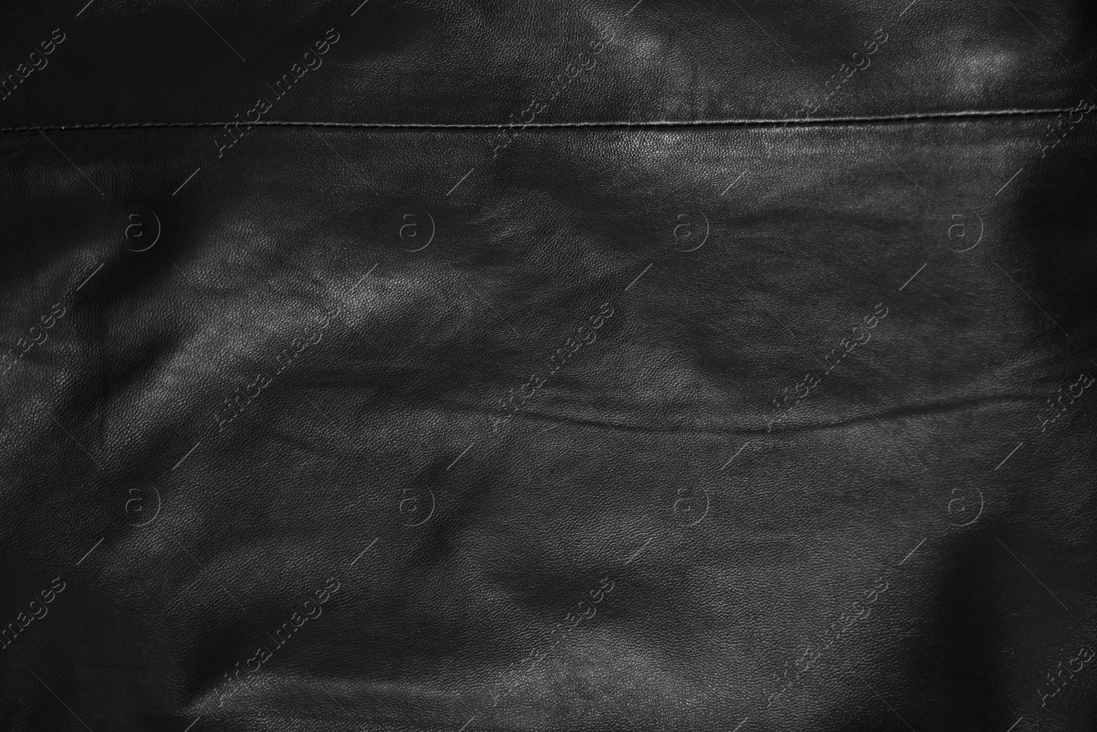 Photo of Texture of black leather as background, top view