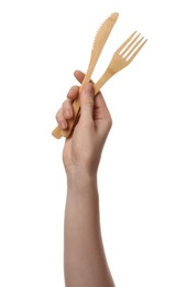 Woman holding eco friendly cutlery on white background, closeup. Conscious consumption