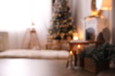 Photo of Blurred view of beautiful room interior with Christmas tree