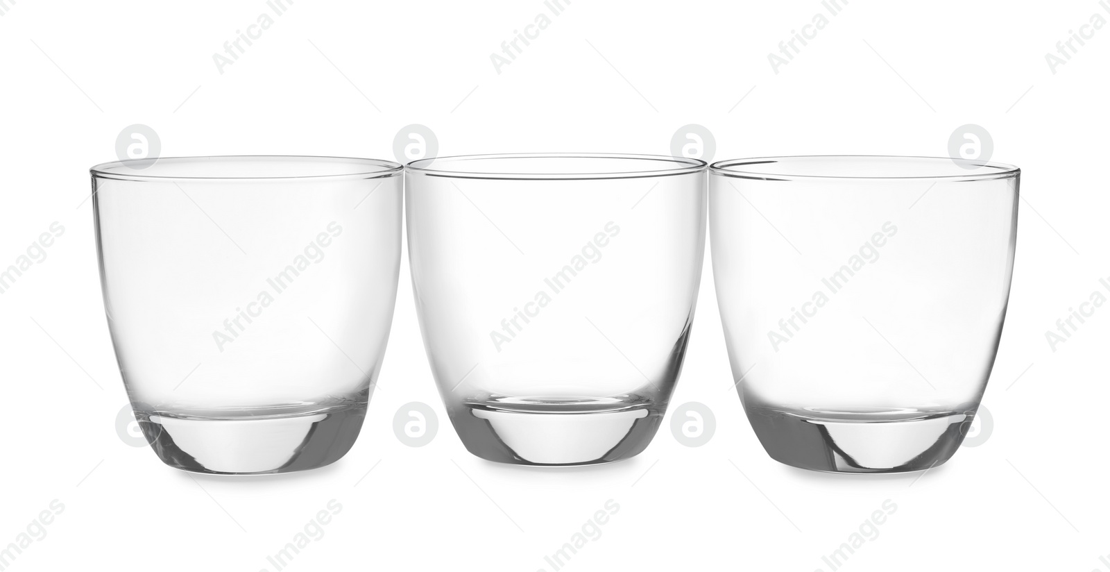 Photo of New clean empty glasses isolated on white