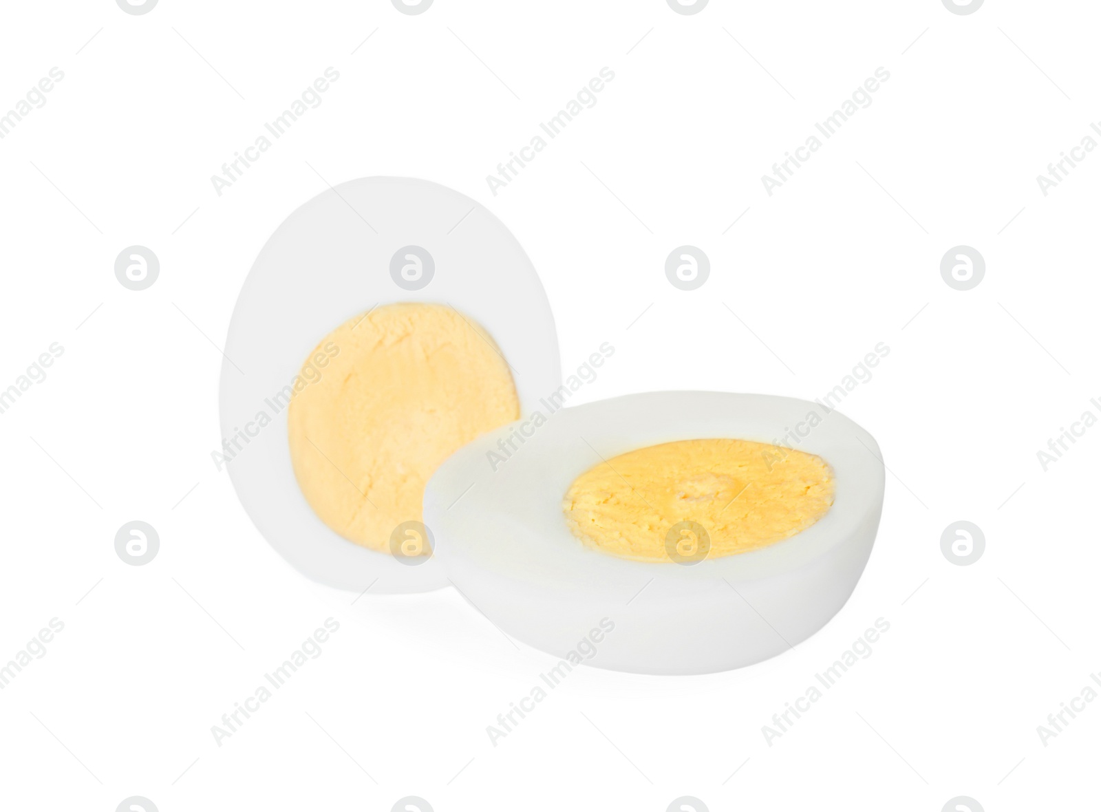 Photo of Halves of fresh hard boiled egg on white background