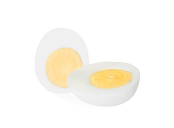 Photo of Halves of fresh hard boiled egg on white background