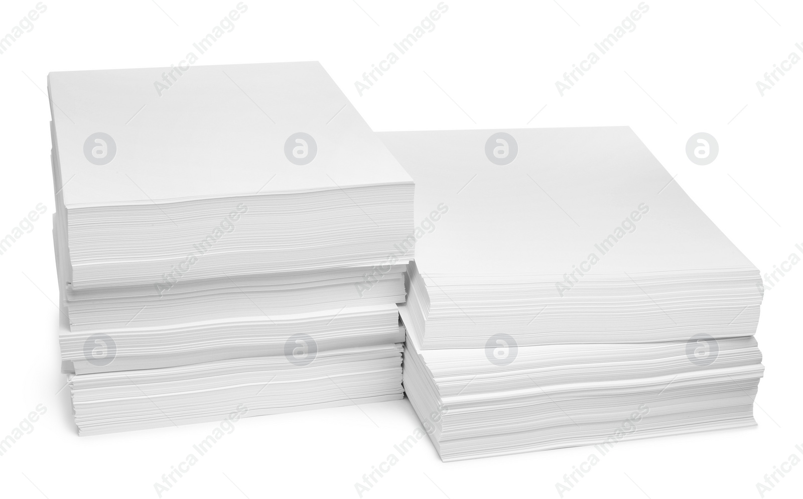 Photo of Stacks of paper sheets on white background