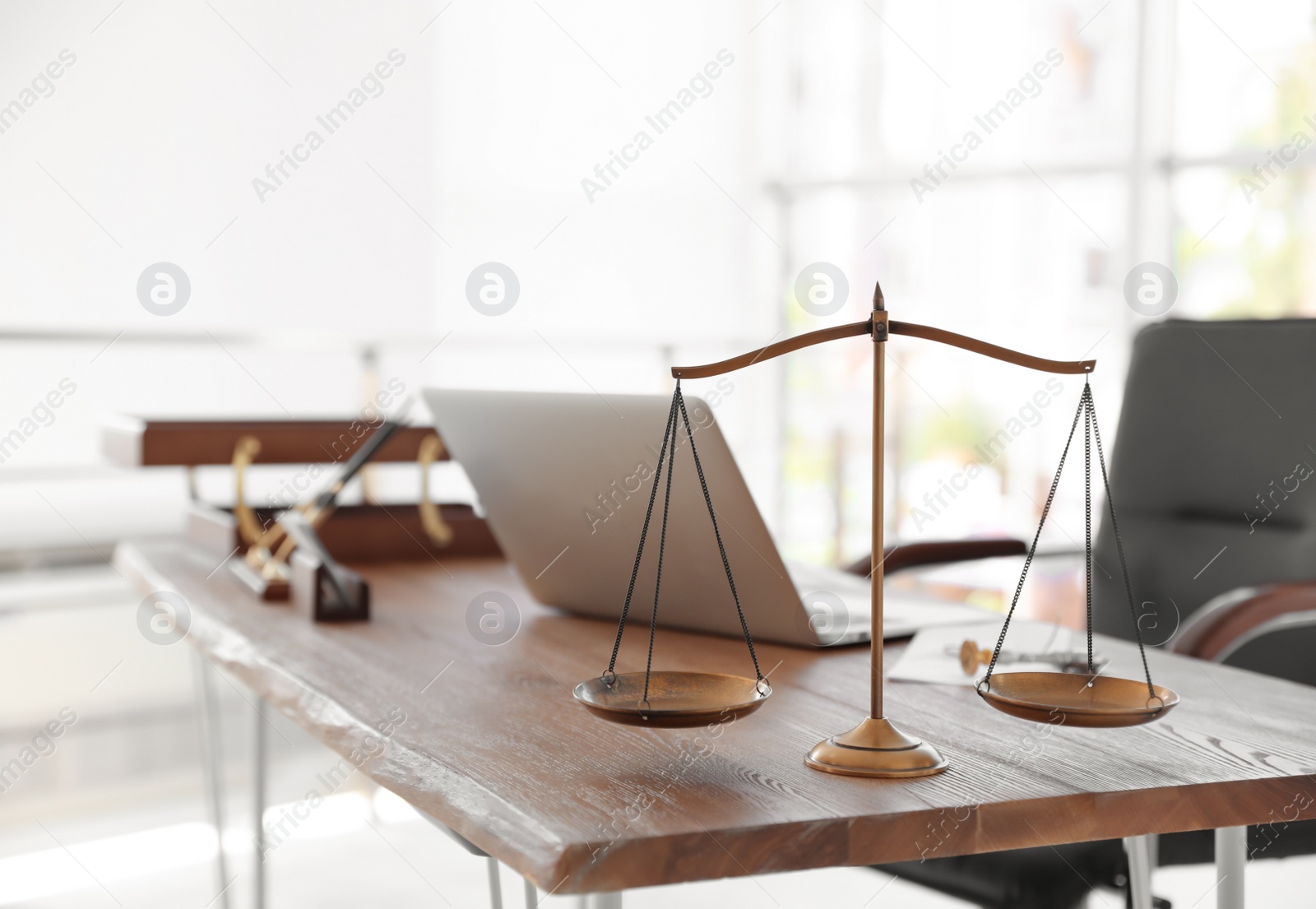 Photo of Scales of justice on desk in notary's office