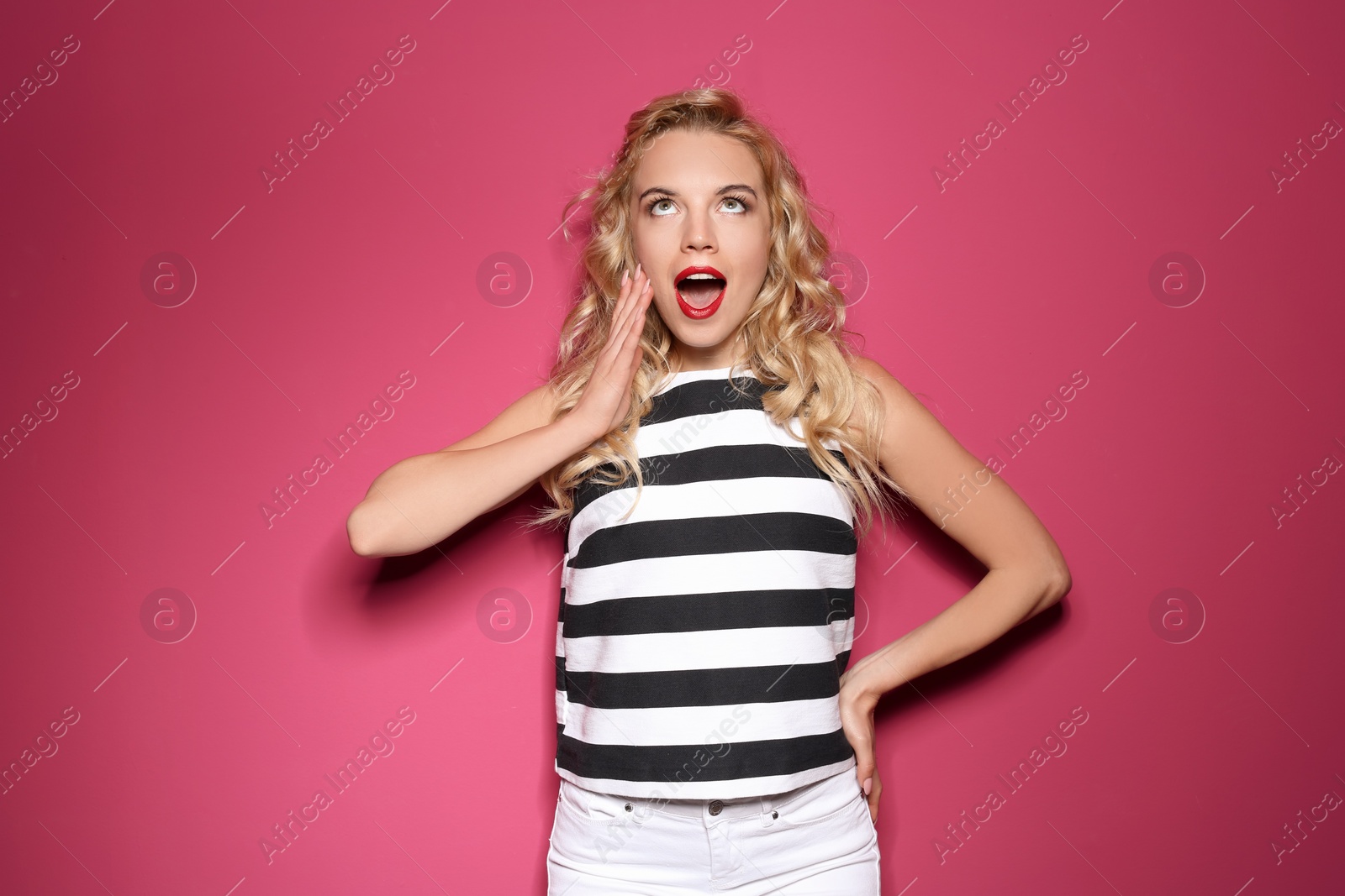 Photo of Emotional stylish young woman on color background